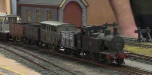 model railway layout with loco on tracks