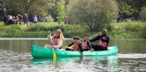 Family in a kayak at Ferry Meadows Peterborough