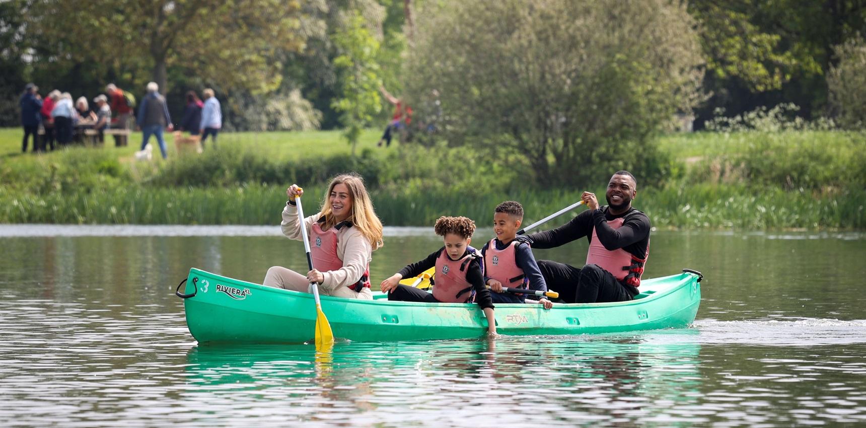 Family in a kayak at Ferry Meadows Peterborough